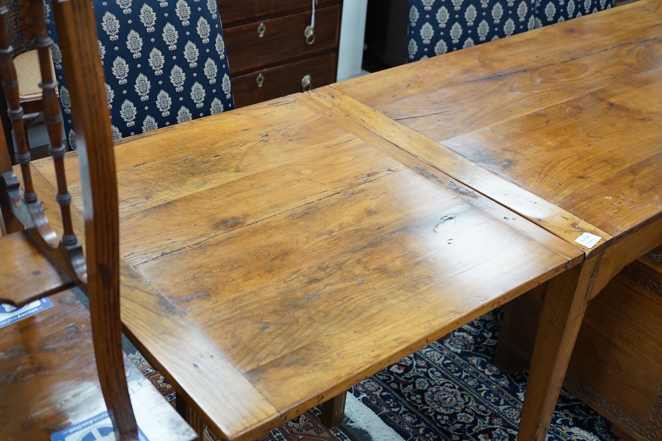 A late 19th century French fruitwood draw leaf table, 166 x 81cm, extends to 317cm, height 78cm *Please note the sale commences at 9am.